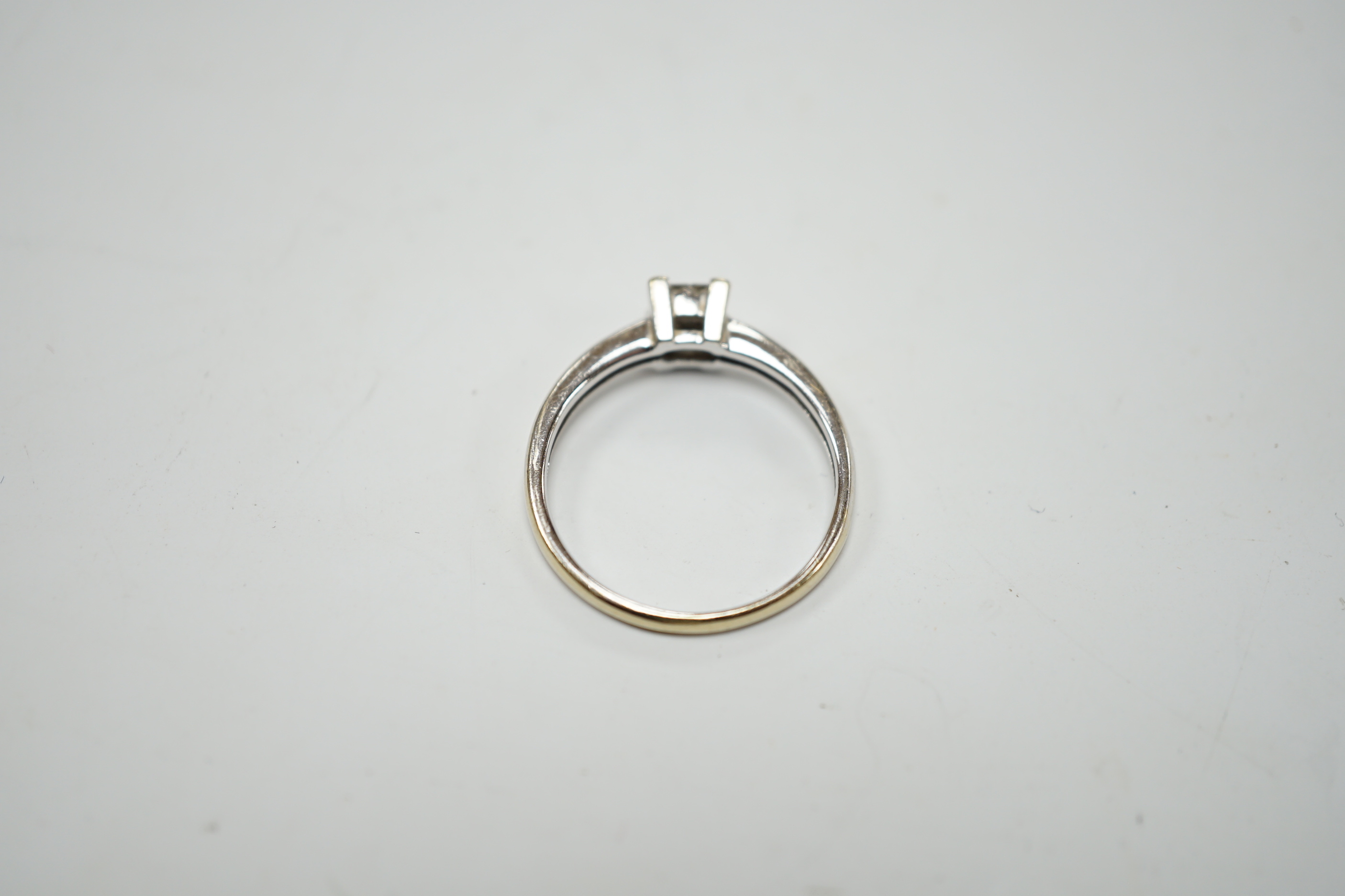 A modern 18ct white gold and four stone diamond set square cluster ring, size P/Q, gross weight 3.2 grams.